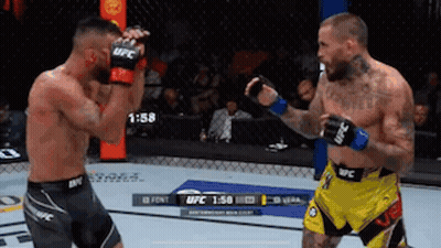 Two Men Fighting In Boxing Ring One In Yellow Shorts GIF