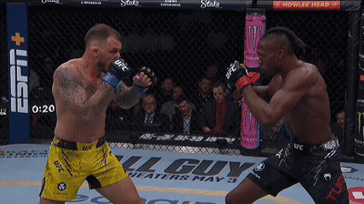 Two Men Fighting In Boxing Ring One Wearing UFC Shorts GIF