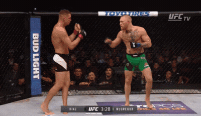 Two Men Fighting In Boxing Ring GIF