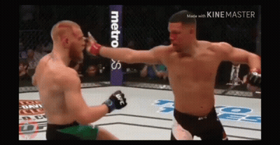 Two Men Fighting In Boxing Ring GIF