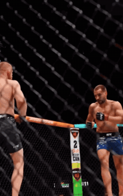 Two Men Fighting In Boxing Ring Saying 2 GIF