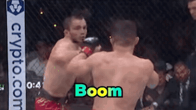 Two Men Fighting In Boxing Ring Saying Boom GIF