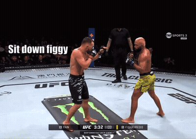Two Men Fighting In Boxing Ring Saying Sit Down Figgy GIF