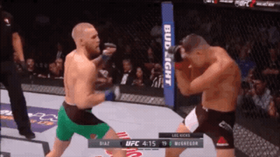 Two Men Fighting In Boxing Ring GIF
