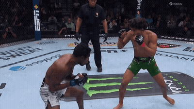 Two Men Fighting In Boxing Ring Sponsored By ESPN And Monster GIF
