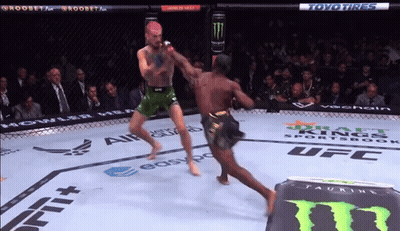 Two Men Fighting In Boxing Ring Sponsored By Toyo GIF
