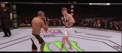Two Men Fighting In Boxing Ring Sponsored By Toyo Tires And Monster GIF
