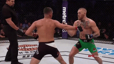 Two Men Fighting In Boxing Ring GIF