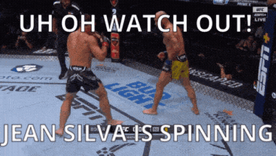 Two Men Fighting In Boxing Ring Uh Oh Watch Out Jean Silva Is Spinning GIF