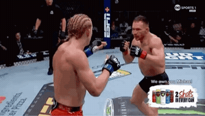 Two Men Fighting In Boxing Ring With 2 Shots In Every Can GIF