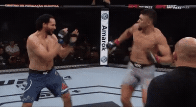 Two Men Fighting In Boxing Ring With Amarok Sign GIF