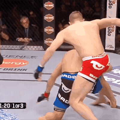 Two Men Fighting In Boxing Ring With Bad Boy Shorts GIF