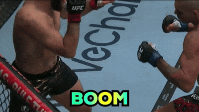 Two Men Fighting In Boxing Ring With Boom GIF