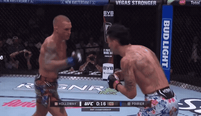 Two Men Fighting In Boxing Ring With Bud Light Ad GIF