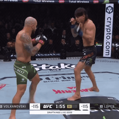 Two Men Fighting In Boxing Ring With Crypto.com Banner GIF
