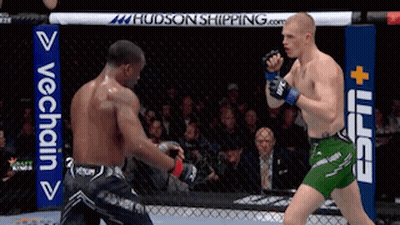 Two Men Fighting In Boxing Ring With ESPN Sign GIF