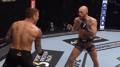 Two Men Fighting In Boxing Ring With Geico Sign GIF