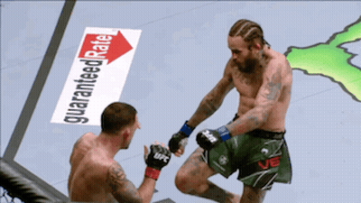 Two Men Fighting In Boxing Ring With Guaranteed Rate Sign GIF