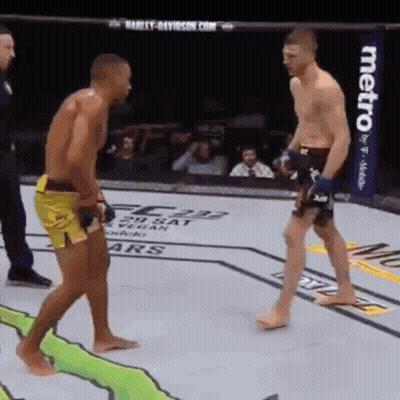 Two Men Fighting In Boxing Ring With Metro Sign GIF