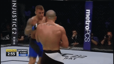 Two Men Fighting In Boxing Ring With MetroPCS Banner GIF