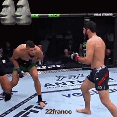 Two Men Fighting In Boxing Ring With Moai Heads GIF