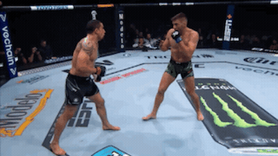 Two Men Fighting In Boxing Ring With Monster Energy Ad GIF