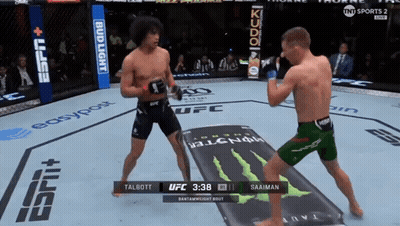 Two Men Fighting In Boxing Ring With Monster Energy Ad GIF