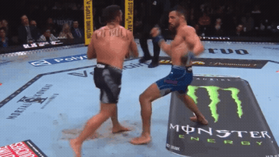 Two Men Fighting In Boxing Ring With Monster Energy Can GIF