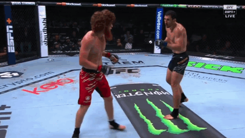Two Men Fighting In Boxing Ring With Monster Energy Logo GIF
