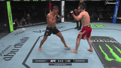 Two Men Fighting In Boxing Ring With Monster Energy Mat GIF