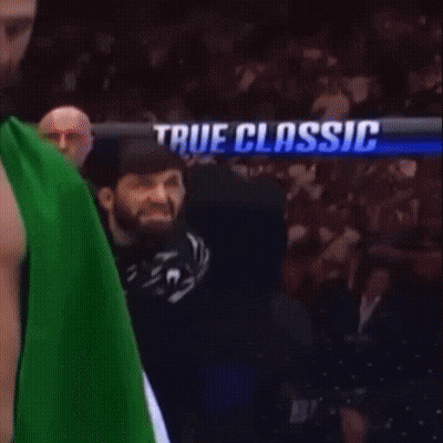 Two Men Fighting In Boxing Ring With No Holds Barred Shorts GIF