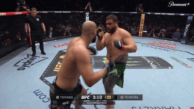 Two Men Fighting In Boxing Ring With Paramount Logo GIF