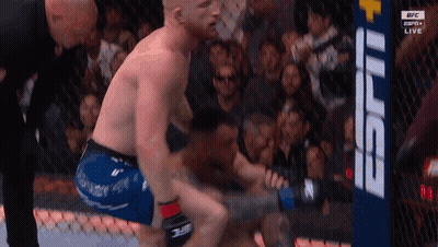 Two Men Fighting In Boxing Ring With Referee GIF