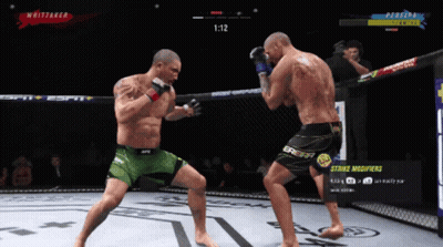 Two Men Fighting In Boxing Ring With Strike Modifiers Button GIF