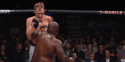 Two Men Fighting In Boxing Ring With T-Mobile Banner GIF