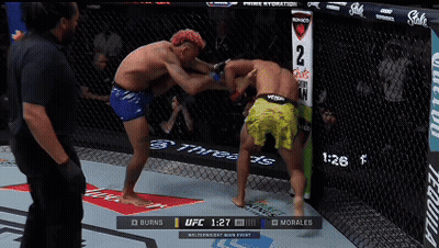 Two Men Fighting In Boxing Ring With UFC 1:27 Display GIF