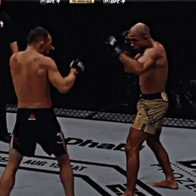 Two Men Fighting In Boxing Ring With UFC 4 GIF
