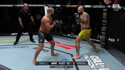 Two Men Fighting In Boxing Ring With UFC Logo GIF