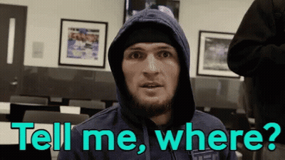Two Men Fighting In Boxing Ring With UFC Shorts GIF