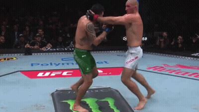 Two Men Fighting In Boxing Ring GIF