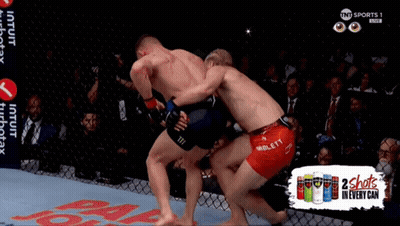 Two Men Fighting In Cage 2 Shots In Every Can GIF