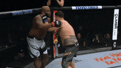 Two Men Fighting In Cage GIF