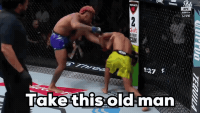 Two Men Fighting In Cage Saying Take This Old Man GIF