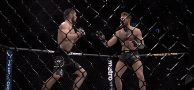 Two Men Fighting In Cage With Metro Sign GIF