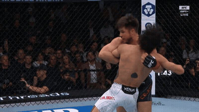 Two Men Fighting In Cage With Venum Tattoo GIF