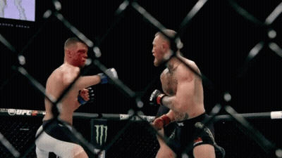 Two Men Fighting In Cage GIF