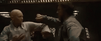Two Men Fighting In Dark Room GIF