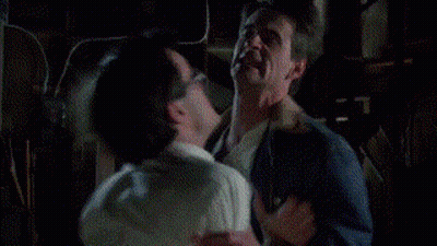 Two Men Fighting In Dark Room GIF