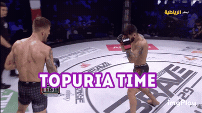 Two Men Fighting In Ring Topuria Time GIF