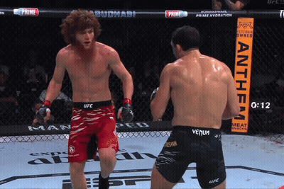 Two Men Fighting In Ring With Anthem Sign GIF